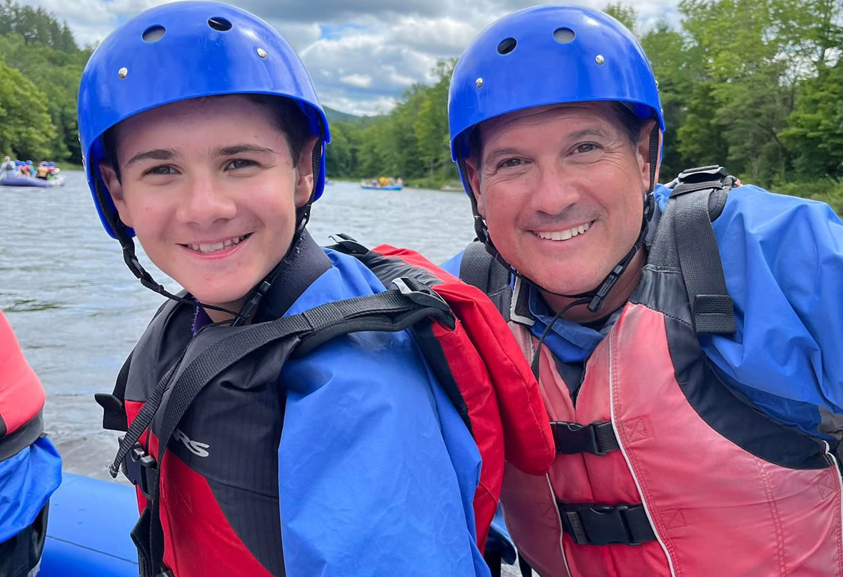 Close up of father and son in kayak
